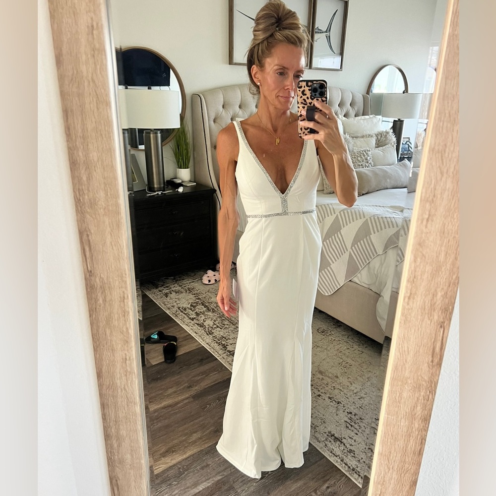 Stunning neckline and back!!!! Worn once, white full length formal.